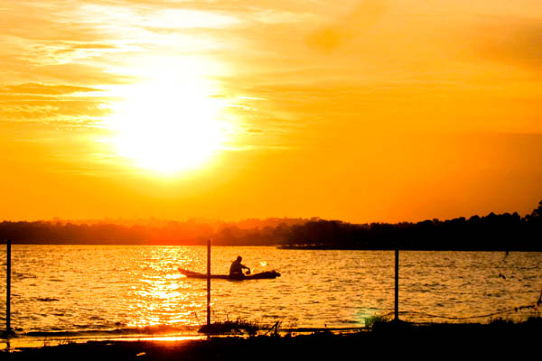 Fisherman at sunset on Lake Victoria, Uganda